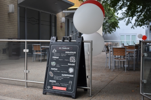 photo of A-frame menu board outside Al Taglio restaurant